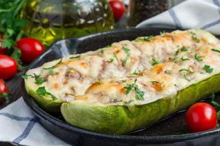 Фаршированные кабачки с чесноком и зеленью в духовке