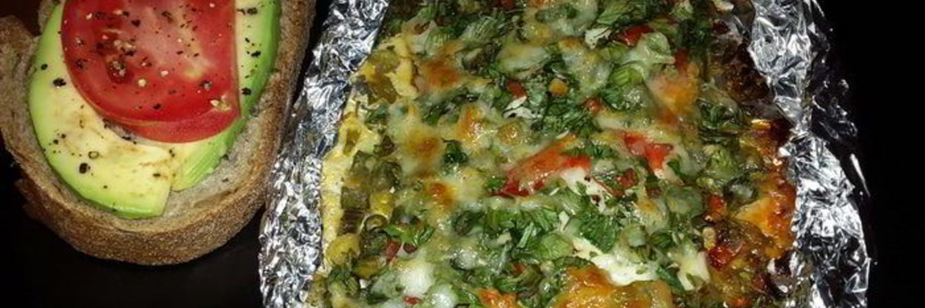 Филе лаврака, запеченное с зеленью и сыром